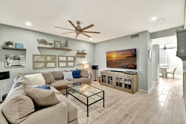 living room featuring ceiling fan