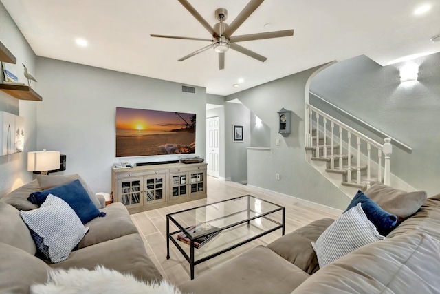 living room featuring ceiling fan and light wood-type flooring