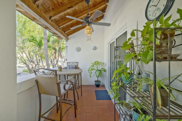 view of patio featuring a balcony and ceiling fan