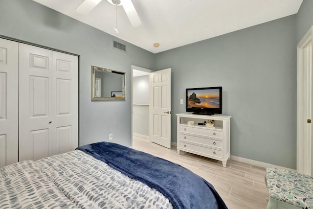 bedroom featuring ceiling fan and a closet