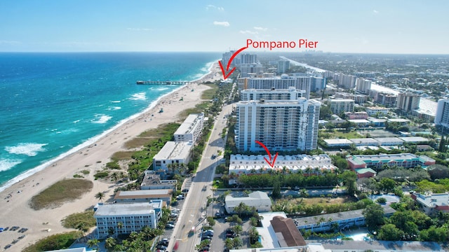 aerial view featuring a water view and a beach view