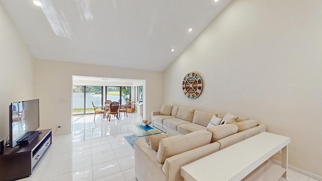 tiled living room with high vaulted ceiling