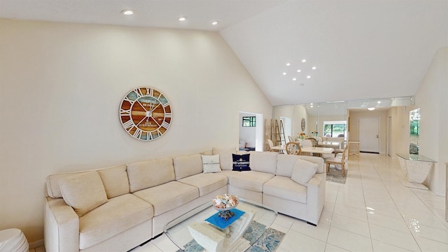 tiled living room with high vaulted ceiling