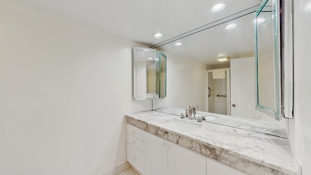 bathroom featuring vanity and tile patterned flooring