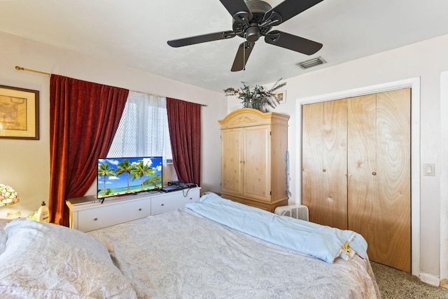 bedroom featuring ceiling fan, a closet, and carpet floors