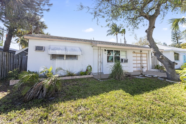 back of property featuring cooling unit and a lawn