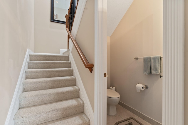 stairs with tile patterned flooring