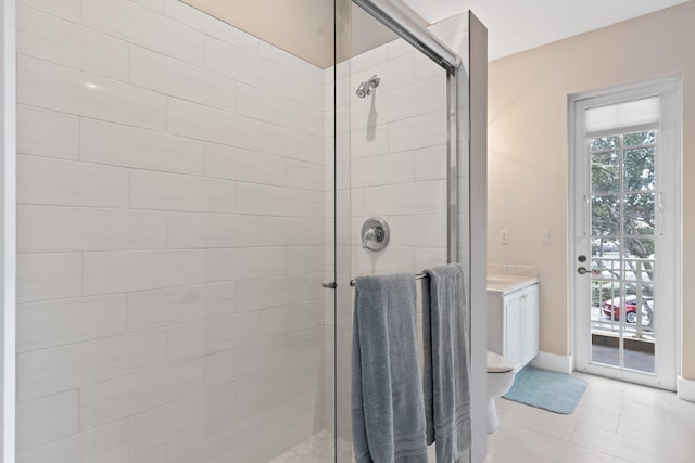 bathroom featuring vanity, an enclosed shower, and toilet