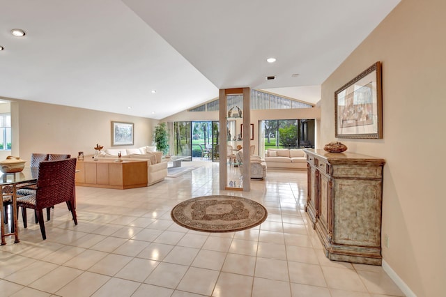 interior space featuring light tile patterned floors and vaulted ceiling