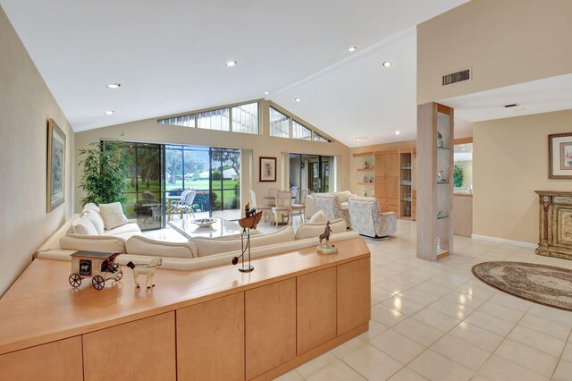 living room with light tile patterned flooring and lofted ceiling