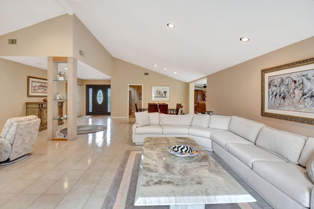 tiled living room with vaulted ceiling