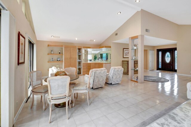 tiled living room featuring ceiling fan