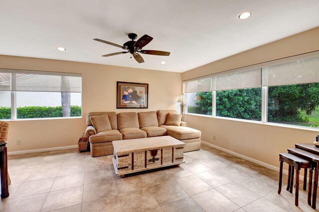 tiled dining space featuring ceiling fan