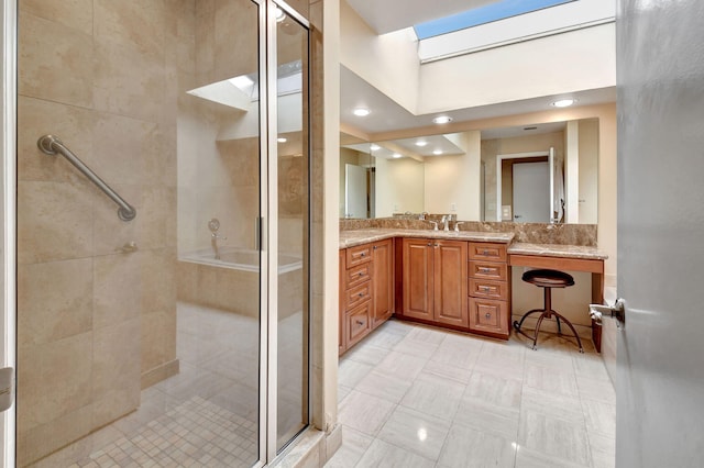 bathroom featuring a shower with shower door, tile patterned floors, and vanity