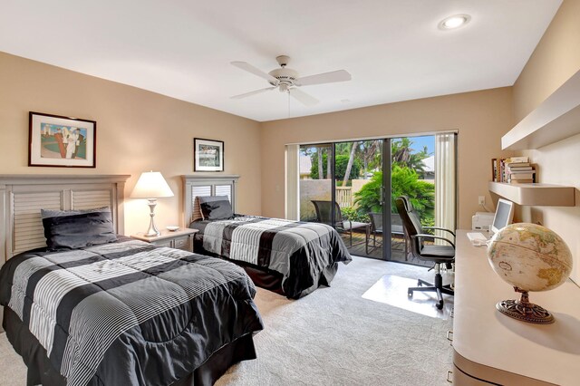 carpeted bedroom with ceiling fan and multiple closets