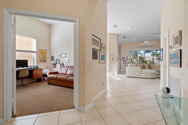 corridor with light tile patterned floors