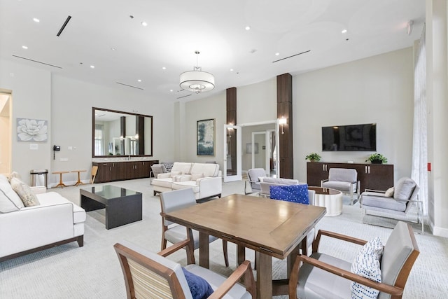 dining room with light colored carpet