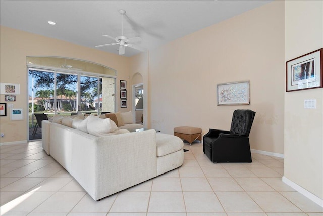 living room featuring ceiling fan and light tile patterned flooring