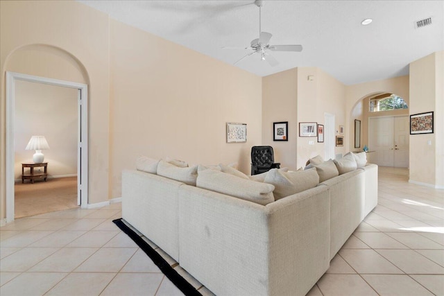 tiled living room with ceiling fan