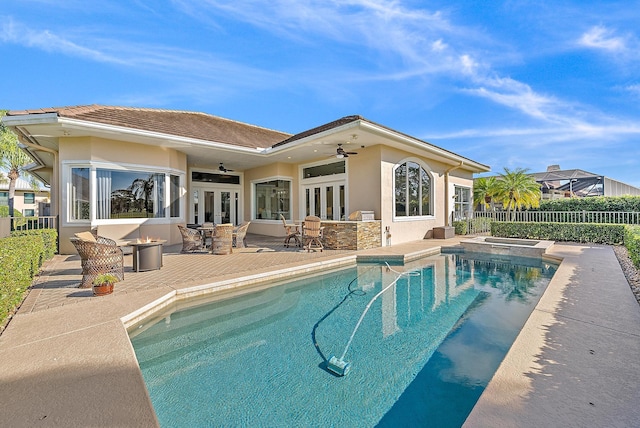 view of swimming pool featuring a patio, french doors, and ceiling fan