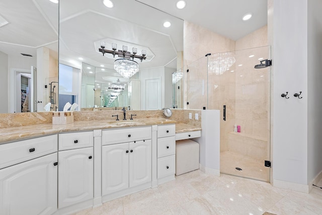 bathroom with vanity and an enclosed shower