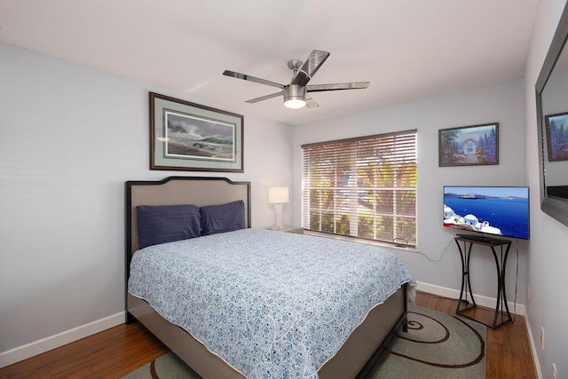 bedroom featuring wood-type flooring and ceiling fan