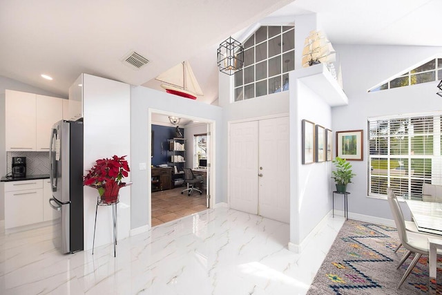 foyer with lofted ceiling