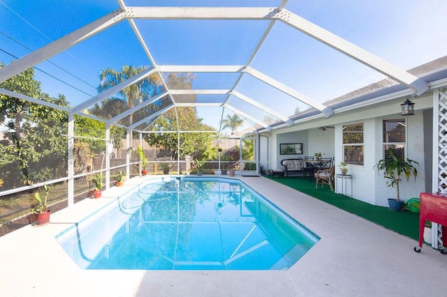 view of pool with a lanai and a patio area