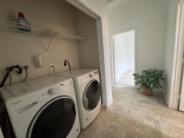 washroom featuring washer and clothes dryer