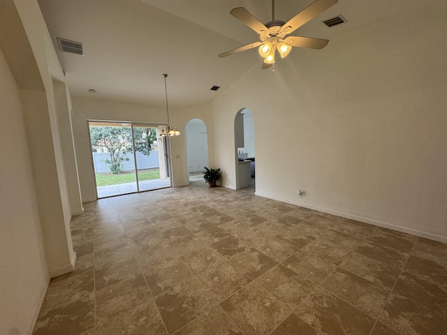 unfurnished room featuring ceiling fan with notable chandelier