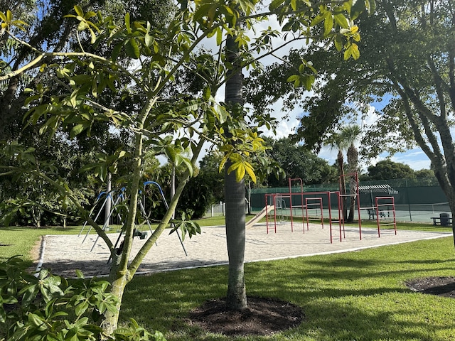 view of playground with a lawn