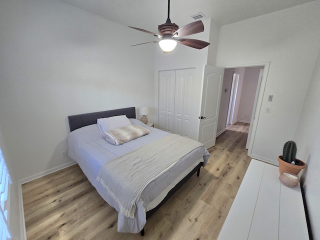 6001 Spring Lake Ter, Fort Pierce, FL 34951 - bedroom featuring light wood-style flooring, a closet, baseboards, and ceiling fan