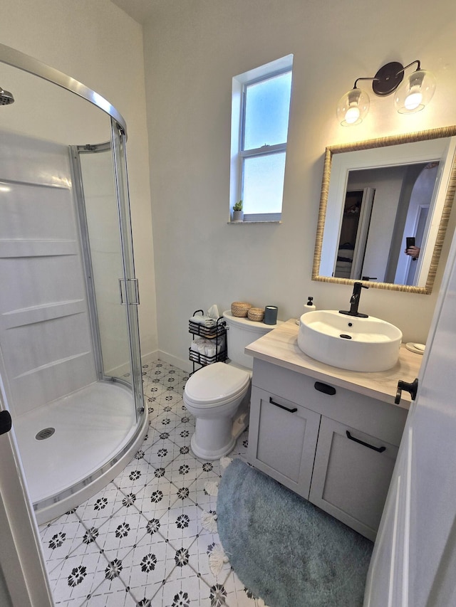 6001 Spring Lake Ter, Fort Pierce, FL 34951 - full bathroom with a shower stall, vanity, toilet, and baseboards