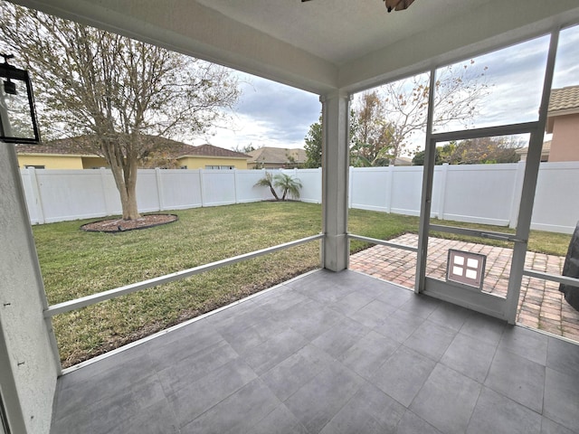 6001 Spring Lake Ter, Fort Pierce, FL 34951 - unfurnished sunroom featuring plenty of natural light and ceiling fan