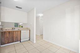 kitchen with white dishwasher and sink