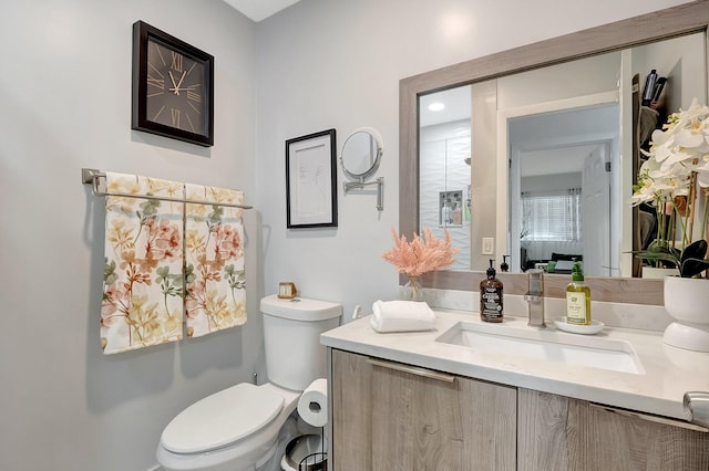 bathroom with vanity and toilet