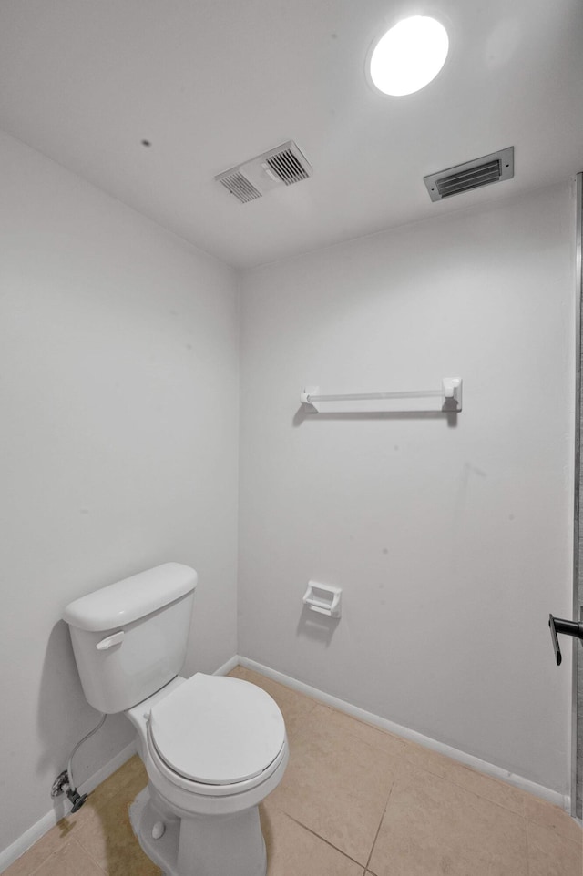 bathroom featuring tile patterned flooring and toilet