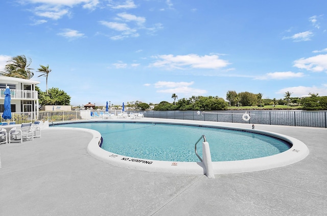 view of swimming pool with a patio