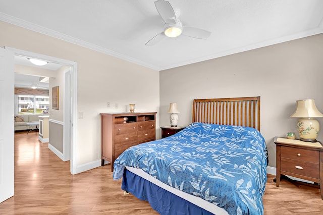 bedroom featuring ceiling fan, crown molding, and wood-type flooring