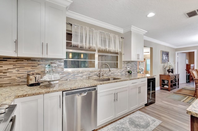 kitchen featuring light stone countertops, beverage cooler, sink, dishwasher, and white cabinetry