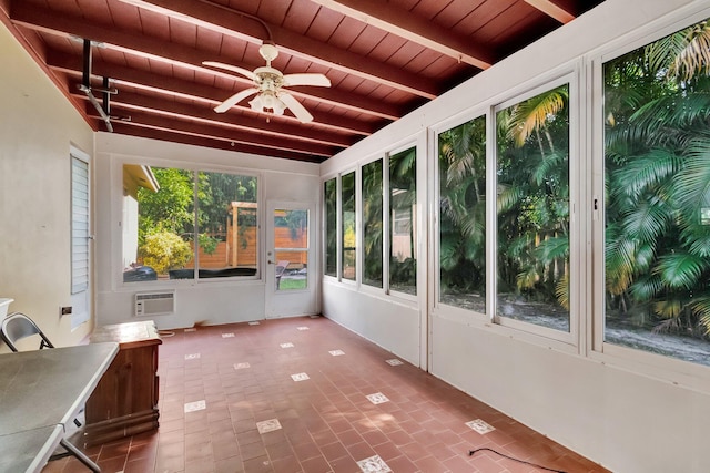 unfurnished sunroom featuring a wall mounted AC, lofted ceiling with beams, ceiling fan, and wooden ceiling