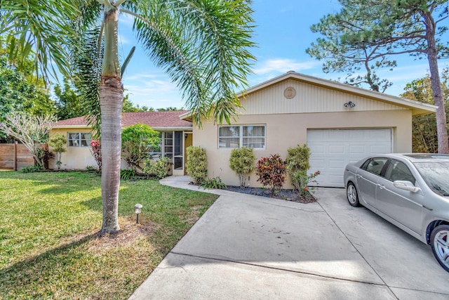 single story home featuring a garage and a front yard