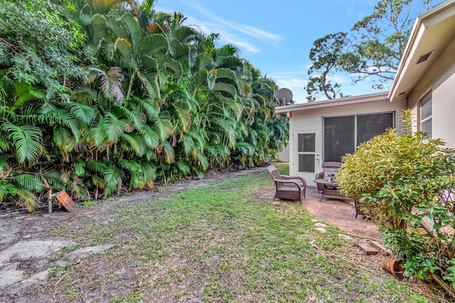 view of yard with a patio area