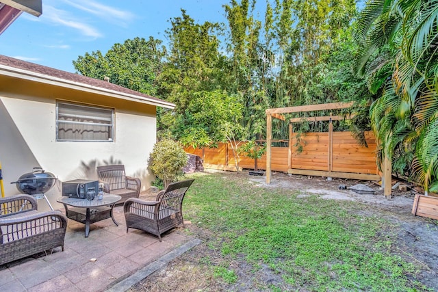 view of yard with an outdoor living space and a patio area