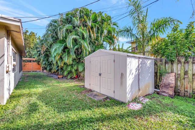 view of outbuilding featuring a lawn