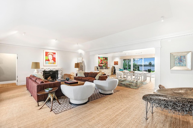 living room featuring ornamental molding and light colored carpet