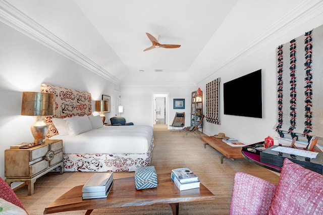 bedroom with ceiling fan, crown molding, and vaulted ceiling