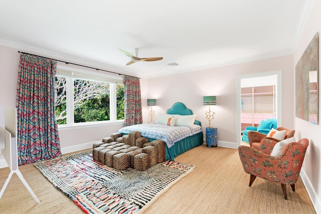 bedroom with ceiling fan and ornamental molding