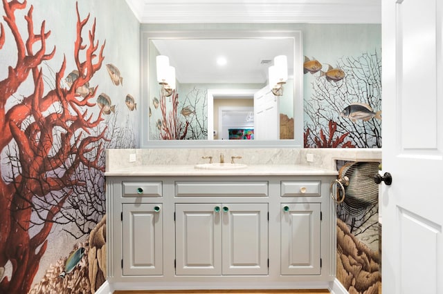 bathroom with vanity and ornamental molding