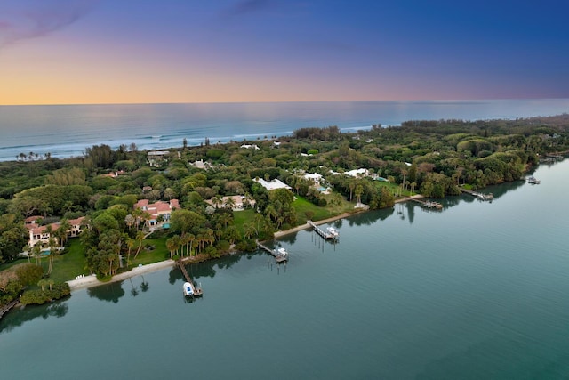 aerial view at dusk with a water view